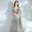 Élégant Argenté Dansant Robe De Bal 2021 Princesse Col v profond Sans Manches Paillettes Tachetée Tulle Longue Volants Dos Nu Robe De Ceremonie