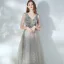 Élégant Argenté Dansant Robe De Bal 2021 Princesse Col v profond Sans Manches Paillettes Tachetée Tulle Longue Volants Dos Nu Robe De Ceremonie