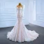 Luxury / Gorgeous Champagne Bridal Wedding Dresses 2021 Trumpet / Mermaid See-through Scoop Neck Puffy Long Sleeve Sequins Court Train Ruffle