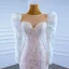 Luxury / Gorgeous Champagne Bridal Wedding Dresses 2021 Trumpet / Mermaid See-through Scoop Neck Puffy Long Sleeve Sequins Court Train Ruffle