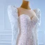Luxury / Gorgeous Champagne Bridal Wedding Dresses 2021 Trumpet / Mermaid See-through Scoop Neck Puffy Long Sleeve Sequins Court Train Ruffle