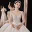 Luxury / Gorgeous Champagne Bridal Wedding Dresses 2021 Ball Gown See-through V-Neck Long Sleeve Backless Appliques Lace Beading Sequins Cathedral Train Ruffle