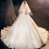 Illusion Champagne See-through Bridal Wedding Dresses 2021 Ball Gown V-Neck Long Sleeve Appliques Lace Beading Tassel Glitter Tulle Royal Train Ruffle