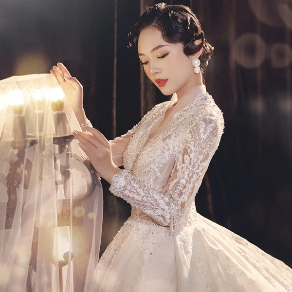 Illusion Champagne See-through Bridal Wedding Dresses 2021 Ball Gown V-Neck Long Sleeve Appliques Lace Beading Tassel Glitter Tulle Royal Train Ruffle