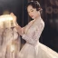 Illusion Champagne See-through Bridal Wedding Dresses 2021 Ball Gown V-Neck Long Sleeve Appliques Lace Beading Tassel Glitter Tulle Royal Train Ruffle