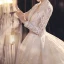 Illusion Champagne See-through Bridal Wedding Dresses 2021 Ball Gown V-Neck Long Sleeve Appliques Lace Beading Tassel Glitter Tulle Royal Train Ruffle