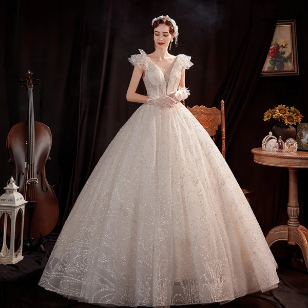 Abordable Ivoire Robe De Mariée 2021 Robe Boule Transparentes Col v profond Sans Manches Dos Nu Perlage Glitter Tulle Longue Volants