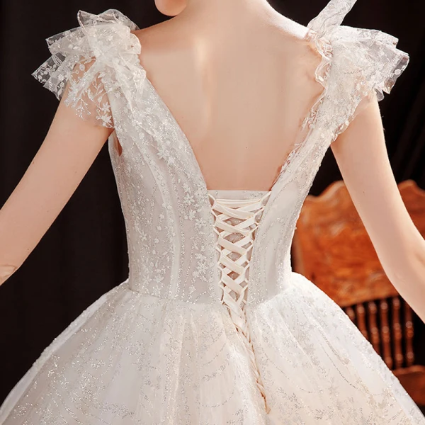 Abordable Ivoire Robe De Mariée 2021 Robe Boule Transparentes Col v profond Sans Manches Dos Nu Perlage Glitter Tulle Longue Volants