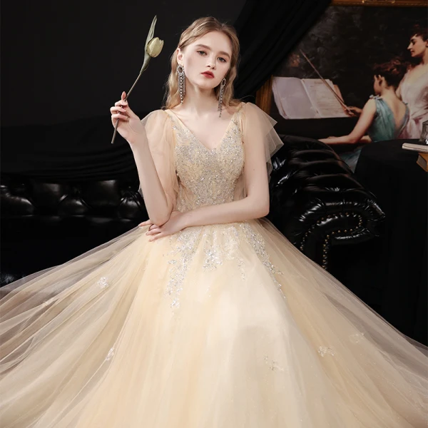 Chic / Belle Champagne Dansant Robe De Bal 2021 Princesse V-Cou Sans Manches Perlage Paillettes Glitter Tulle Longue Volants Dos Nu Robe De Ceremonie