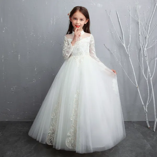 Piękne Białe Sukienki Dla Dziewczynek 2020 Princessa Przezroczyste Wysokiej Szyi Długie Rękawy Aplikacje Z Koronki Frezowanie Perła Długie Wzburzyć