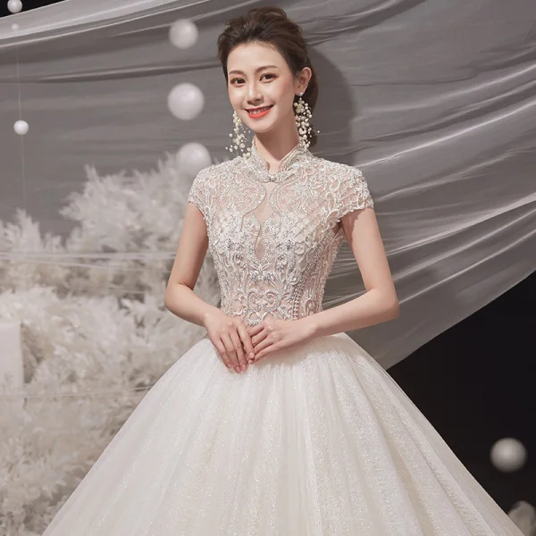 Illusion Champagne Bridal Wedding Dresses 2020 Ball Gown High Neck Short Sleeve Backless Beading Glitter Tulle Cathedral Train Ruffle