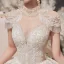 Luxury / Gorgeous Champagne See-through Bridal Wedding Dresses 2020 Ball Gown High Neck Short Sleeve Appliques Lace Beading Tassel Glitter Tulle Cathedral Train