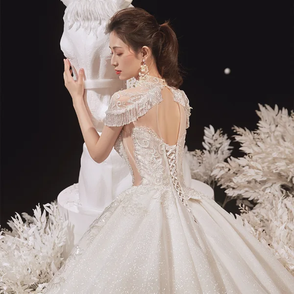 Luxury / Gorgeous Champagne See-through Bridal Wedding Dresses 2020 Ball Gown High Neck Short Sleeve Appliques Lace Beading Tassel Glitter Tulle Cathedral Train
