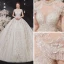 Luxury / Gorgeous Champagne See-through Bridal Wedding Dresses 2020 Ball Gown High Neck Short Sleeve Appliques Lace Beading Tassel Glitter Tulle Cathedral Train