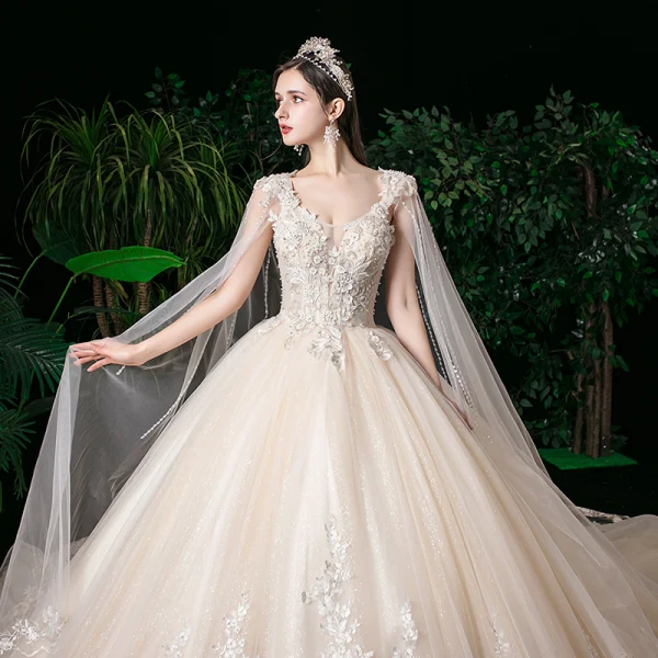 Romantic Champagne See-through Bridal Wedding Dresses 2020 Ball Gown Scoop Neck Sleeveless Backless Appliques Lace Beading Glitter Tulle Watteau Train Ruffle