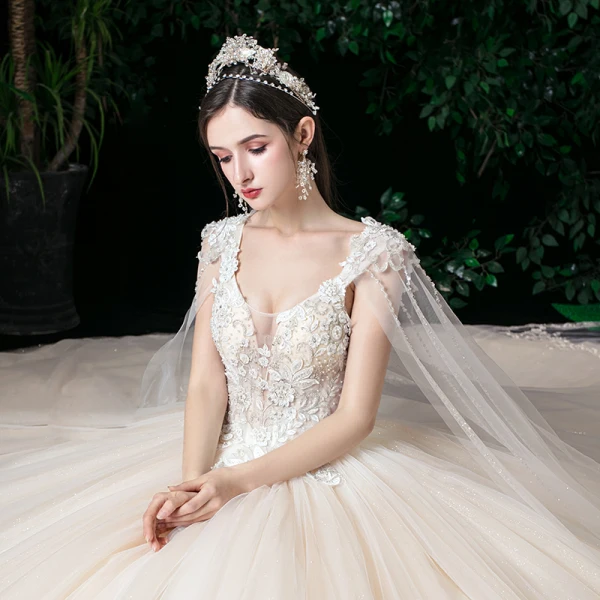 Romantic Champagne See-through Bridal Wedding Dresses 2020 Ball Gown Scoop Neck Sleeveless Backless Appliques Lace Beading Glitter Tulle Watteau Train Ruffle