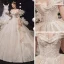 Luxe Champagne La Mariée Robe De Mariée 2020 Robe Boule De l'épaule Manches Courtes Dos Nu Appliques En Dentelle Perlage Glitter Tulle Chapel Train Volants