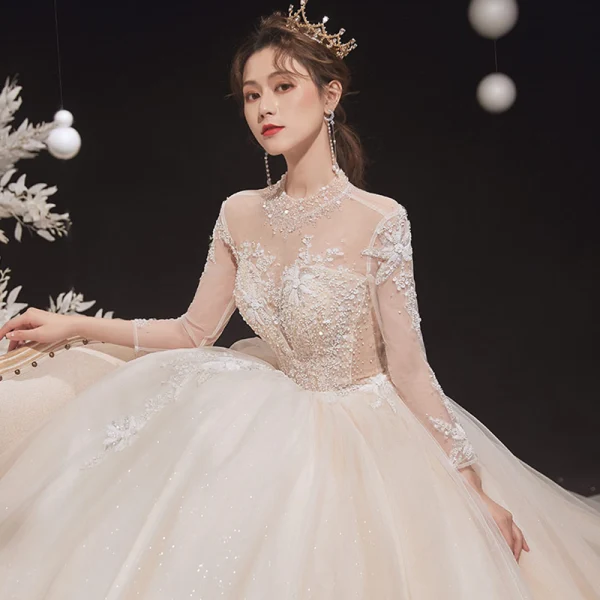 Illusion Champagne See-through Bridal Wedding Dresses 2020 Ball Gown High Neck Long Sleeve Backless Glitter Tulle Appliques Lace Beading Cathedral Train Ruffle