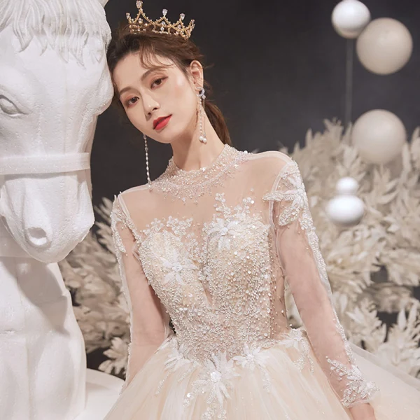 Illusion Champagne See-through Bridal Wedding Dresses 2020 Ball Gown High Neck Long Sleeve Backless Glitter Tulle Appliques Lace Beading Cathedral Train Ruffle