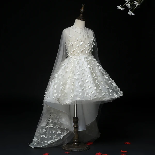 Fée Des Fleurs Blanche Transparentes Robe Ceremonie Fille 2020 Robe Boule Encolure Dégagée Sans Manches Appliques Papillon Perlage Gland Asymétrique Watteau Train Volants