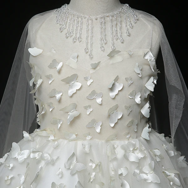 Fée Des Fleurs Blanche Transparentes Robe Ceremonie Fille 2020 Robe Boule Encolure Dégagée Sans Manches Appliques Papillon Perlage Gland Asymétrique Watteau Train Volants