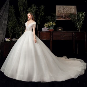 Chic Beautiful Ivory See Through Bridal Wedding Dresses 2020 Ball Gown Scoop Neck Short Sleeve Backless Beading Tassel Glitter Tulle Chapel Train