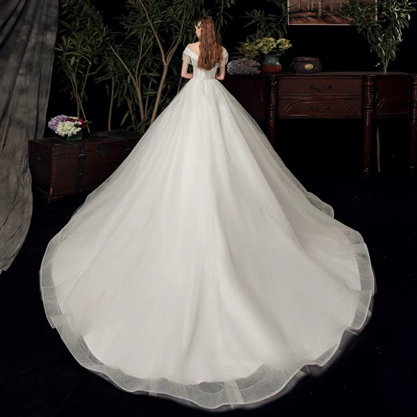 Chic / Belle Ivoire Transparentes La Mariée Robe De Mariée 2020 Robe Boule Encolure Dégagée Manches Courtes Dos Nu Perlage Gland Glitter Tulle Chapel Train