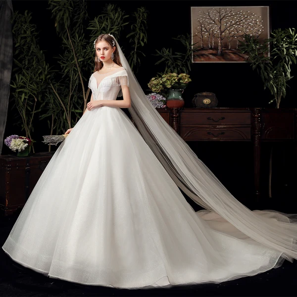 Chic / Belle Ivoire Transparentes La Mariée Robe De Mariée 2020 Robe Boule Encolure Dégagée Manches Courtes Dos Nu Perlage Gland Glitter Tulle Chapel Train