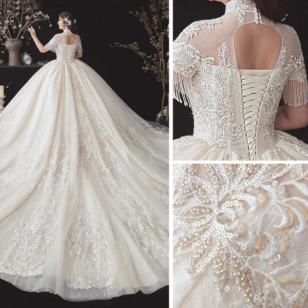 Vintage / Originale Champagne Grande Taille Robe De Mariée 2020 Transparentes Col Haut Manches Courtes Dos Nu Perlage Gland Appliques En Dentelle Paillettes Cathedral Train Volants