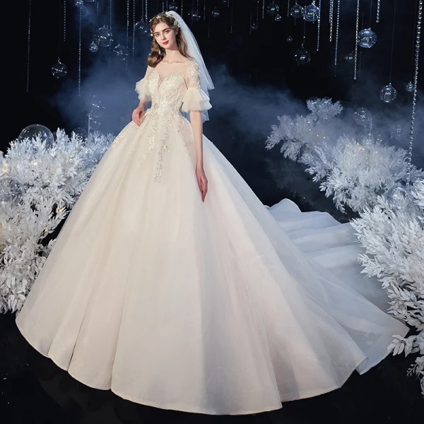 Élégant Champagne Transparentes La Mariée Robe De Mariée 2020 Robe Boule Encolure Carrée 1/2 Manches Manches de cloche Dos Nu Appliques En Dentelle Perlage Glitter Tulle Cathedral Train Volants