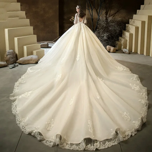 Illusion Champagne See-through Bridal Wedding Dresses 2020 Ball Gown Scoop Neck 3/4 Sleeve Backless Pierced Appliques Lace Beading Cathedral Train Ruffle