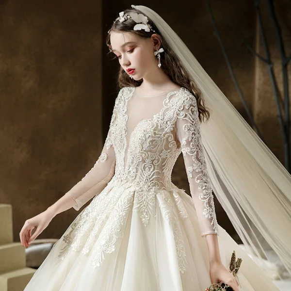 Illusion Champagne See-through Bridal Wedding Dresses 2020 Ball Gown Scoop Neck 3/4 Sleeve Backless Pierced Appliques Lace Beading Cathedral Train Ruffle