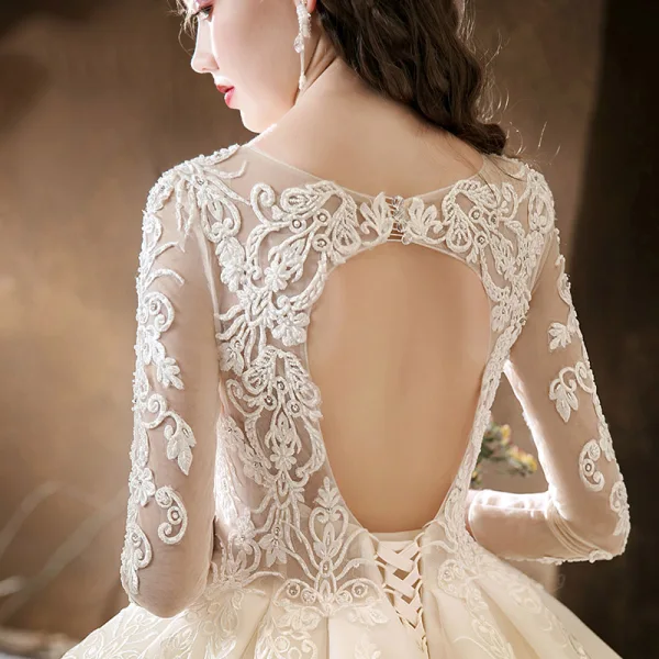 Illusion Champagne See-through Bridal Wedding Dresses 2020 Ball Gown Scoop Neck 3/4 Sleeve Backless Pierced Appliques Lace Beading Cathedral Train Ruffle