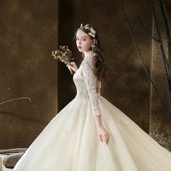 Illusion Champagne See-through Bridal Wedding Dresses 2020 Ball Gown Scoop Neck 3/4 Sleeve Backless Pierced Appliques Lace Beading Cathedral Train Ruffle