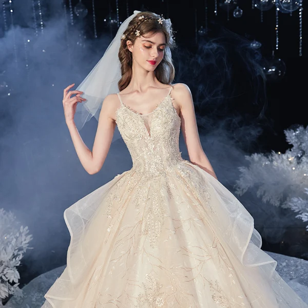 Romantic Champagne Bridal Wedding Dresses 2020 Ball Gown Spaghetti Straps Sleeveless Backless Leaf Appliques Lace Sequins Beading Cathedral Train Ruffle