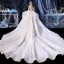 Elegant Ivory Bridal Wedding Dresses 2020 Ball Gown See-through Scoop Neck Short Sleeve Backless Glitter Tulle Appliques Lace Beading Cathedral Train Cascading Ruffles