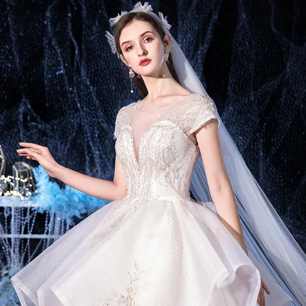 Elegant Ivory Bridal Wedding Dresses 2020 Ball Gown See-through Scoop Neck Short Sleeve Backless Glitter Tulle Appliques Lace Beading Cathedral Train Cascading Ruffles