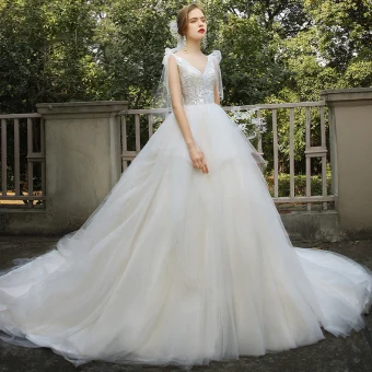 Elegant Champagne Bridal Wedding Dresses 2020 Ball Gown V Neck Sleeveless Backless Appliques Lace Sequins Beading Cathedral Train Ruffle