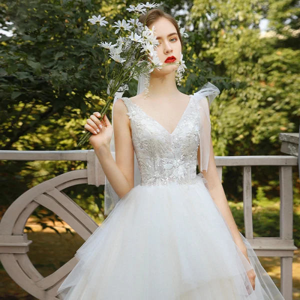 Elegant Champagne Bridal Wedding Dresses 2020 Ball Gown V-Neck Sleeveless Backless Appliques Lace Sequins Beading Cathedral Train Ruffle
