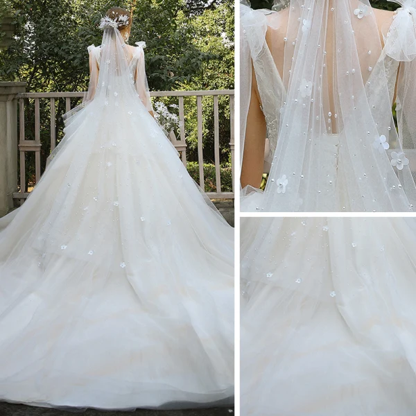 Elegant Champagne Bridal Wedding Dresses 2020 Ball Gown V-Neck Sleeveless Backless Appliques Lace Sequins Beading Cathedral Train Ruffle