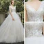 Elegant Champagne Bridal Wedding Dresses 2020 Ball Gown V-Neck Sleeveless Backless Appliques Lace Sequins Beading Cathedral Train Ruffle