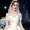 Modest / Simple Ivory Satin Bridal Wedding Dresses 2020 Ball Gown Square Neckline Short Sleeve Backless Cathedral Train Ruffle