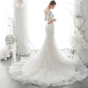 Élégant Ivoire Transparentes La Mariée Robe De Mariée 2020 Trompette Sirène Encolure Dégagée 1 2 Manches Dos Nu Appliques En Dentelle Perlage Tribunal Train Volants
