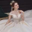 Luxe Champagne La Mariée Robe De Mariée 2020 Robe Boule De l'épaule Manches Courtes Dos Nu Appliques En Dentelle Paillettes Perlage Glitter Tulle Royal Train Volants