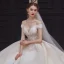 Luxe Champagne La Mariée Robe De Mariée 2020 Robe Boule De l'épaule Manches Courtes Dos Nu Appliques En Dentelle Paillettes Perlage Glitter Tulle Royal Train Volants