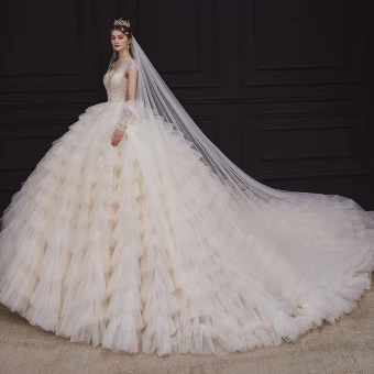 Luxury Gorgeous Champagne Bridal Wedding Dresses 2020 Ball Gown See Through Deep V Neck Sleeveless Backless Appliques Sequins Beading Royal Train Cascading Ruffles