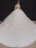 Lyx Champagne Brud Bröllopsklänningar 2020 Balklänning Genomskinliga Djup v-hals Ärmlös Halterneck Appliqués Paljetter Beading Royal Train Cascading Volanger