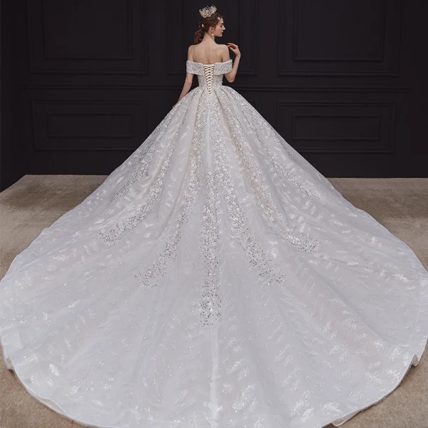Luxe Champagne La Mariée Robe De Mariée 2020 Robe Boule De l'épaule Transparentes V-Cou Manches Courtes Dos Nu Appliques Paillettes Perlage Glitter Tulle Royal Train Volants