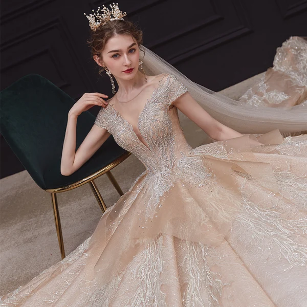 Luxury / Gorgeous Champagne Bridal Wedding Dresses 2020 Ball Gown See-through Scoop Neck Short Sleeve Backless Appliques Lace Sequins Beading Rhinestone Royal Train Ruffle
