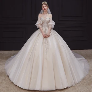 Romantisk Champagne Bryllups Brudekjoler 2020 Ballkjole Av Skulderen Puffy 1 2 Ermer Ryggløse Appliques Beading Glitter Tyll Chapel Train Buste